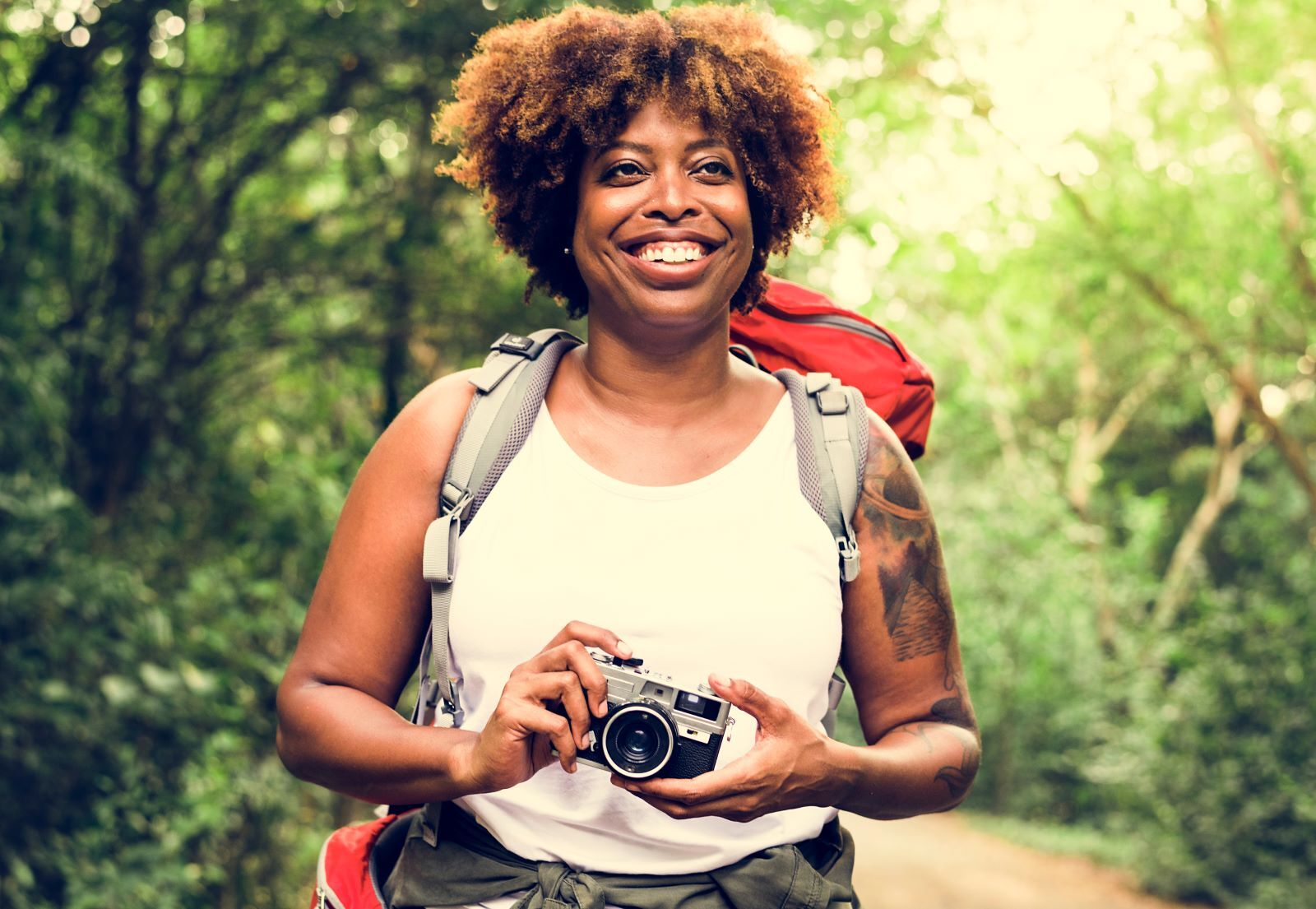 woman photographing nature on a hike